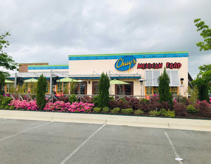 Frontal view of Chuy's Restaurant from a distance