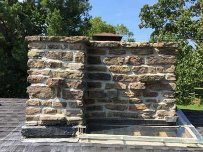 Chimney and skylight showing need for repair