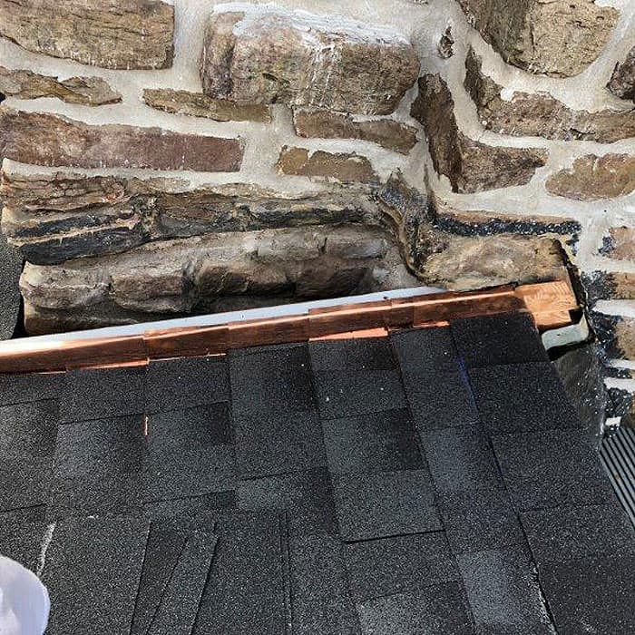 Installing of flashing during a chimney repair
